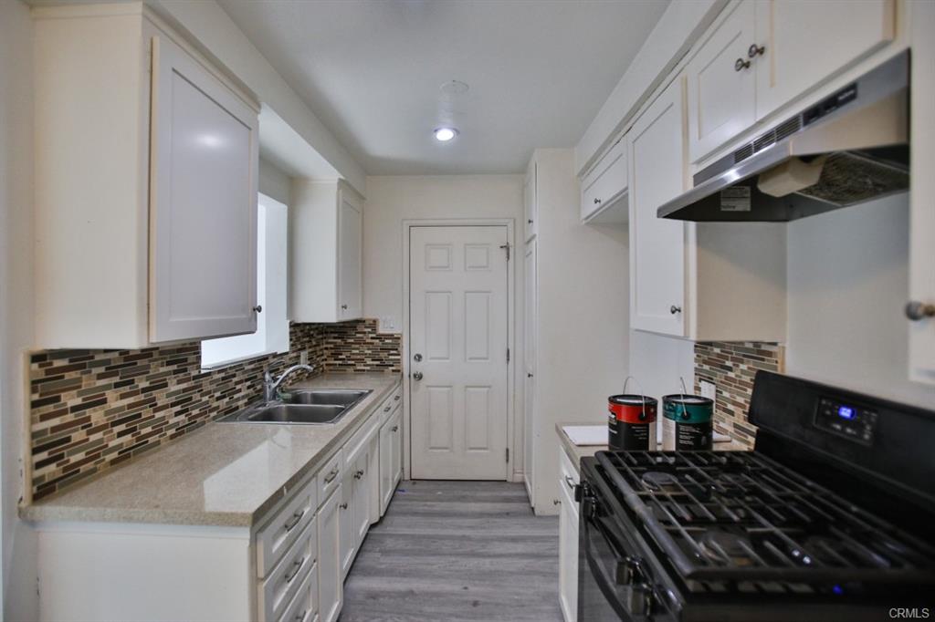 Updated kitchen with modern appliances and granite countertops