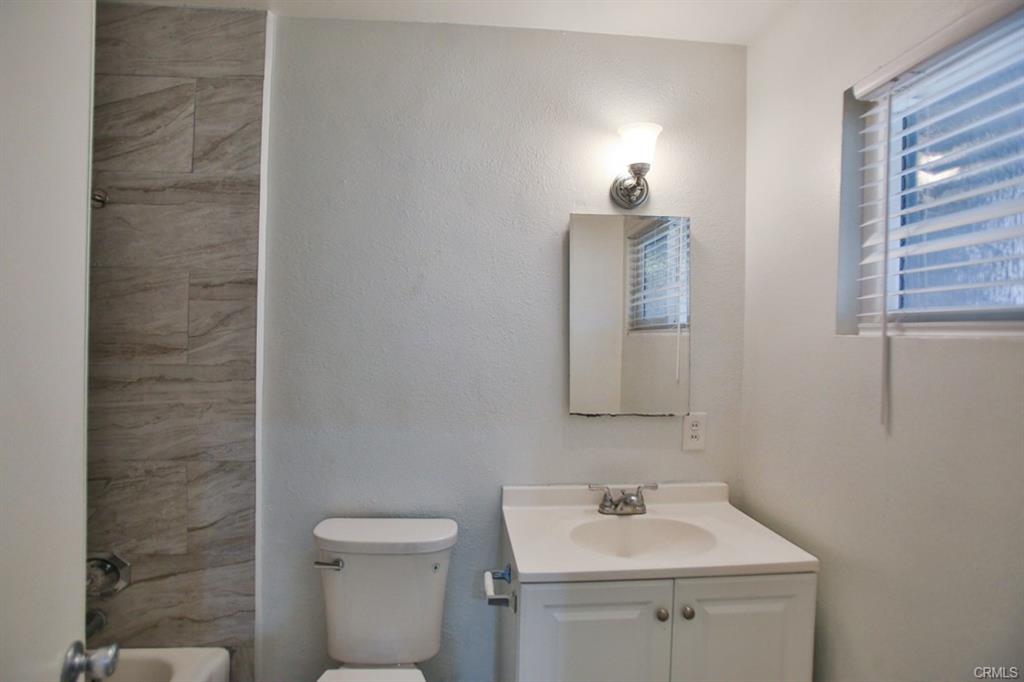 Renovated bathroom with contemporary fixtures and tile work